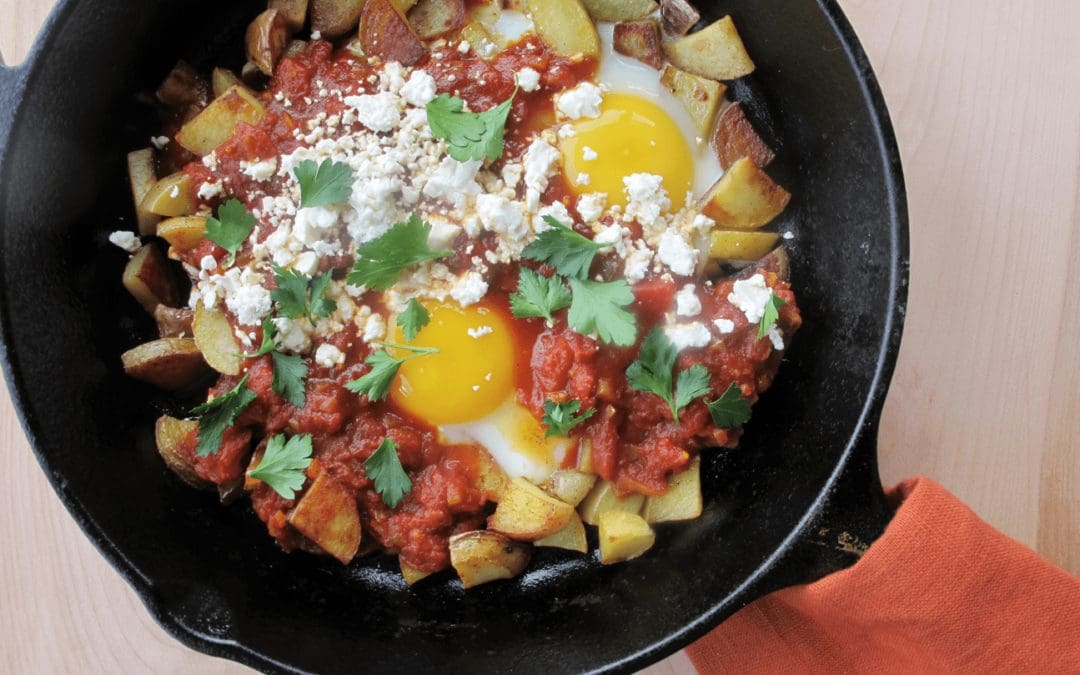 Skillet Potatoes with Eggs and Spiced Tomato Sauce