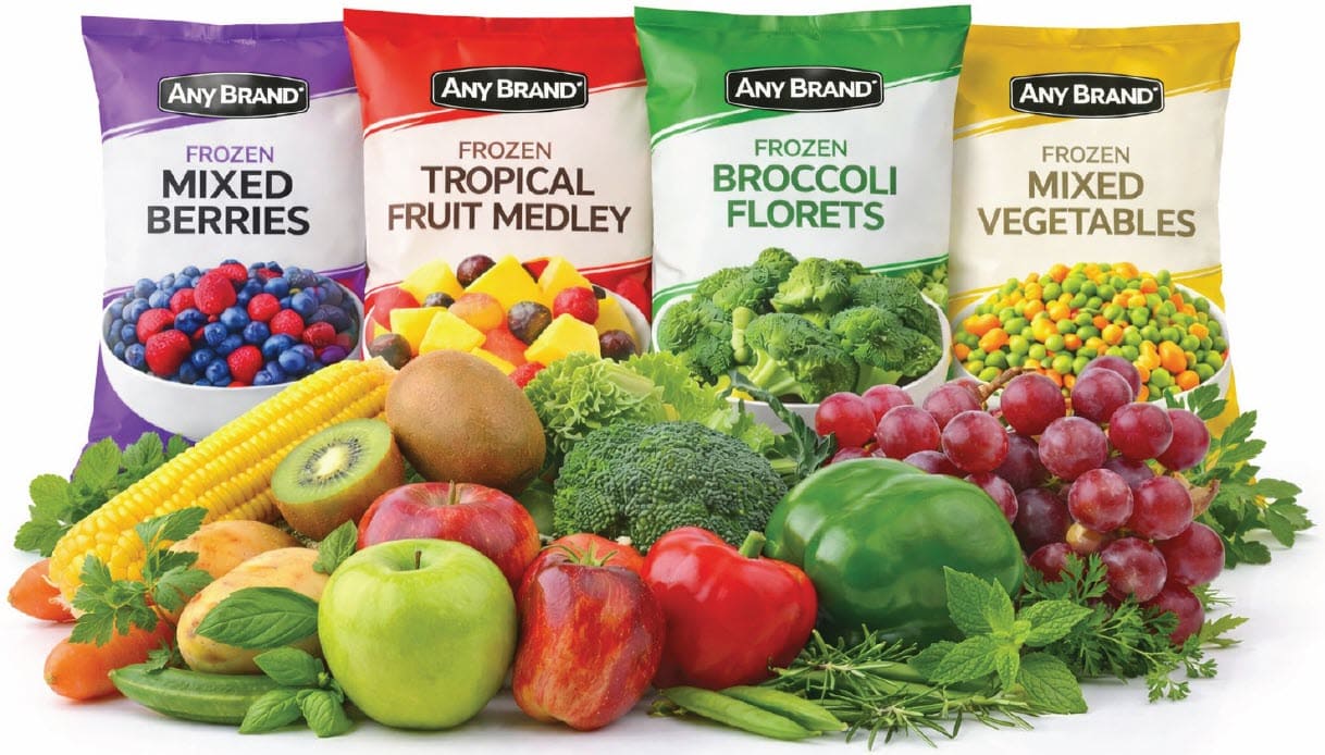 Frozen mixed berries, tropical fruit, broccoli florets, and mixed vegetables in “Any Brand” bags, displayed with assorted fresh fruits and vegetables in front.