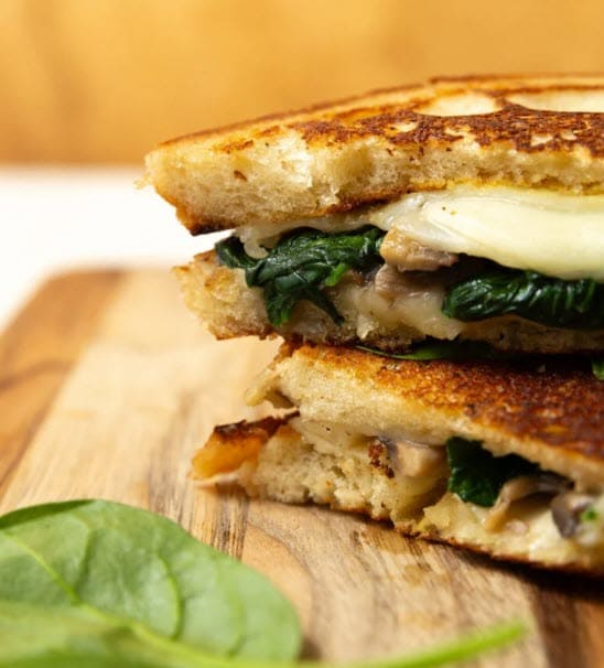 Mushroom Grilled Cheese with Greens on a cutting board