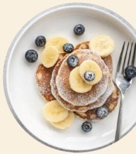 High-Protein Yogurt Pancakes with banana and blueberries