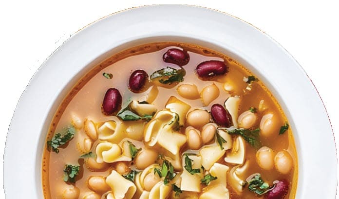 A bowl of chili with a lot of beans
