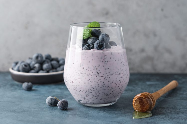Blueberry yogurt chia pudding in a glass cup