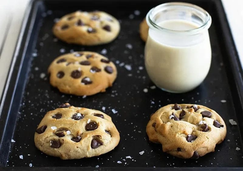 Chocolate Chip Cookies on a tray with milk