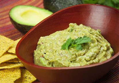 Creamy Avocado Dip in a wooden bowl