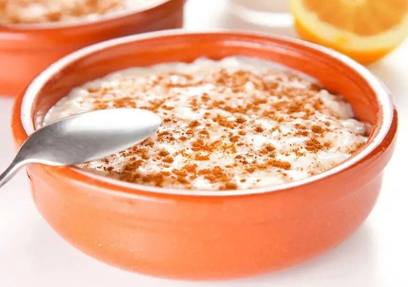 Dairy-Free Quinoa Pudding in an orange bowl