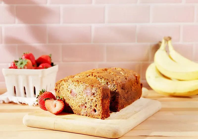 Strawberry Banana Bread on a cutting board